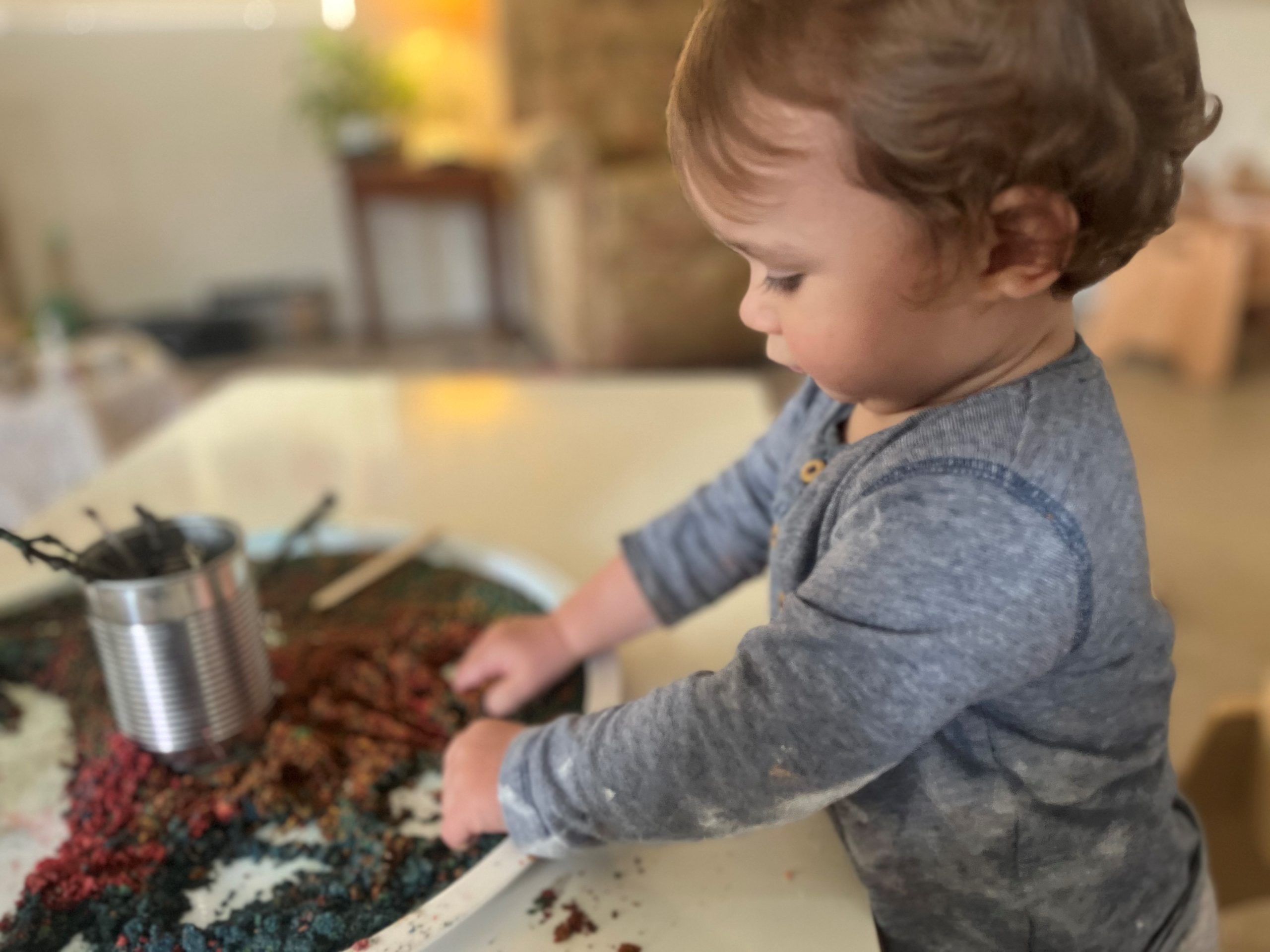 A child having fun with messy play